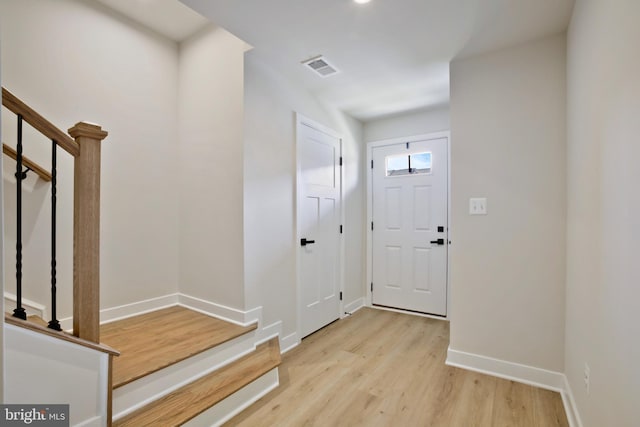 14030 Sunrise Valley Dr, Herndon, VA 20171 - entrance foyer with stairway, visible vents, light wood-type flooring, and baseboards