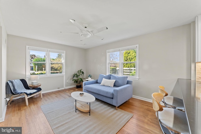 610 Valley Brook Dr, Silver Spring, MD 20904 - living room with baseboards, ceiling fan, and light wood-style flooring
