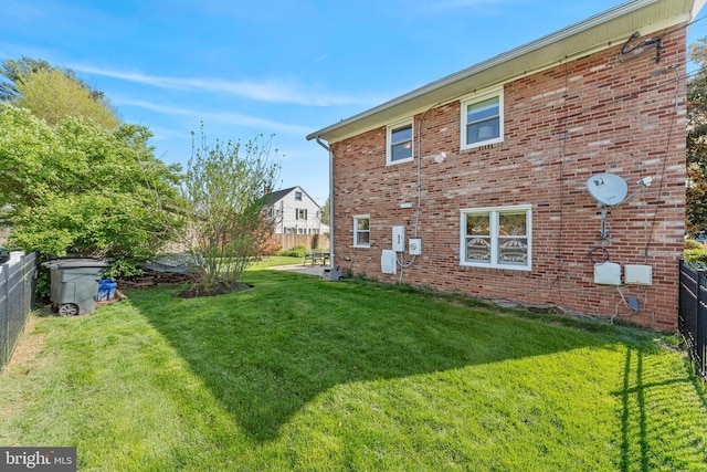 610 Valley Brook Dr, Silver Spring, MD 20904 - back of house featuring brick siding, a fenced backyard, and a yard