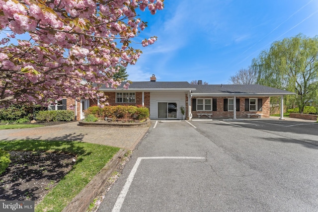 610 Valley Brook Dr, Silver Spring, MD 20904 - ranch-style home featuring a chimney, uncovered parking, and brick siding