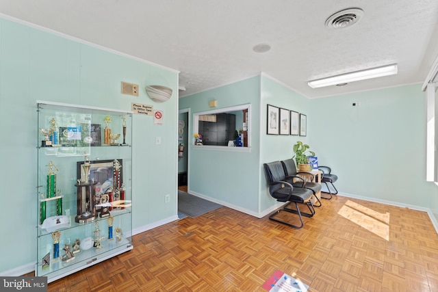 610 Valley Brook Dr, Silver Spring, MD 20904 - living area with a textured ceiling, baseboards, visible vents, and ornamental molding