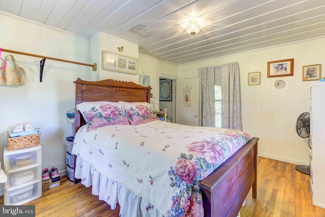 bedroom featuring wood finished floors and wood ceiling