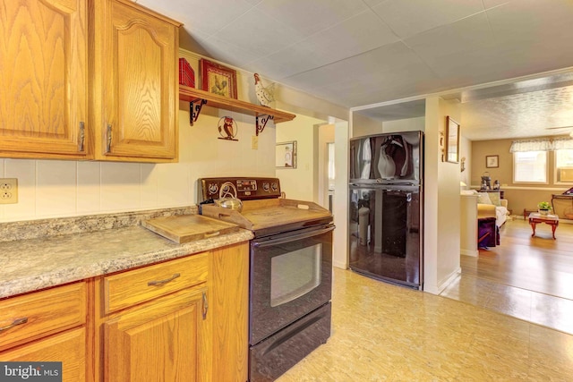 kitchen featuring black appliances and open shelves