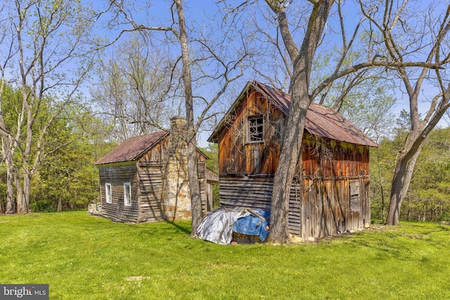 view of barn with a yard