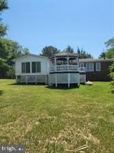 36026 Bay Dr, Chaptico, MD 20621 - rear view of house with a lawn
