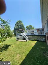 36026 Bay Dr, Chaptico, MD 20621 - view of grassy yard with a deck