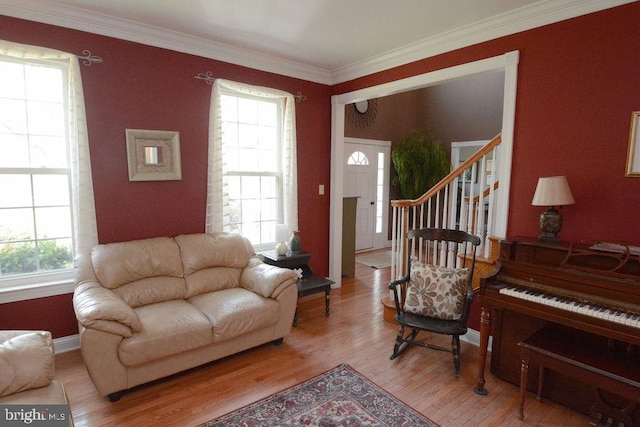2350 Josie Ln, Harleysville, PA 19438 - living room featuring ornamental molding, a wealth of natural light, and light wood-style floors