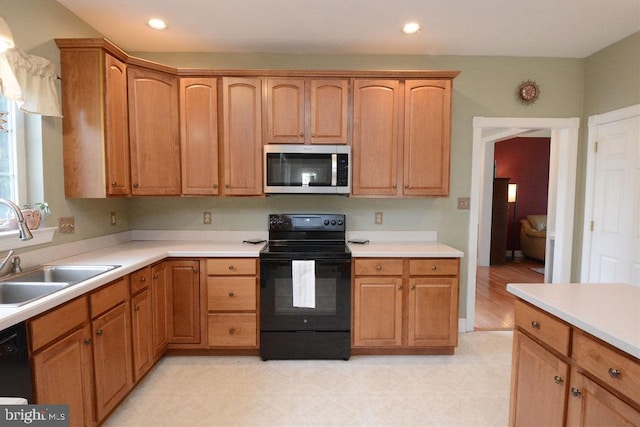 2350 Josie Ln, Harleysville, PA 19438 - kitchen featuring black appliances, light floors, light countertops, and a sink