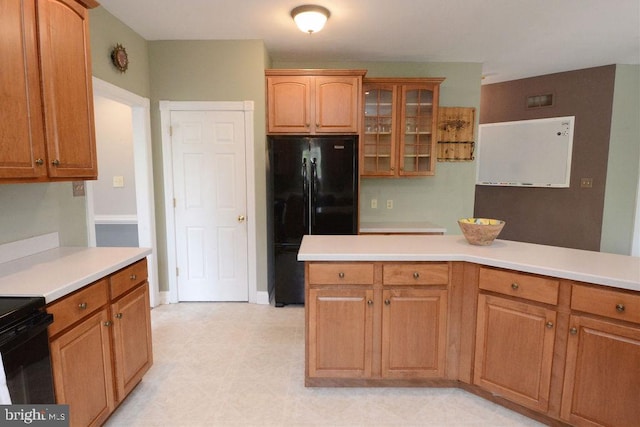2350 Josie Ln, Harleysville, PA 19438 - kitchen with black appliances, light floors, light countertops, and glass insert cabinets