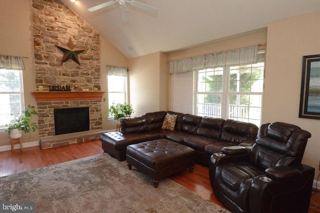 2350 Josie Ln, Harleysville, PA 19438 - living room with wood finished floors, a ceiling fan, high vaulted ceiling, and a stone fireplace