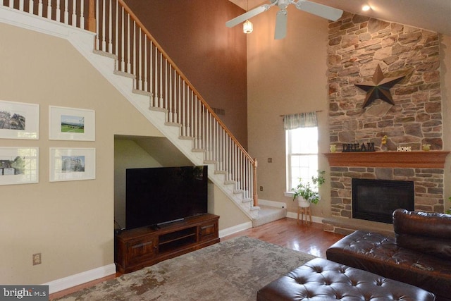 2350 Josie Ln, Harleysville, PA 19438 - living area featuring high vaulted ceiling, wood finished floors, ceiling fan, and stairway