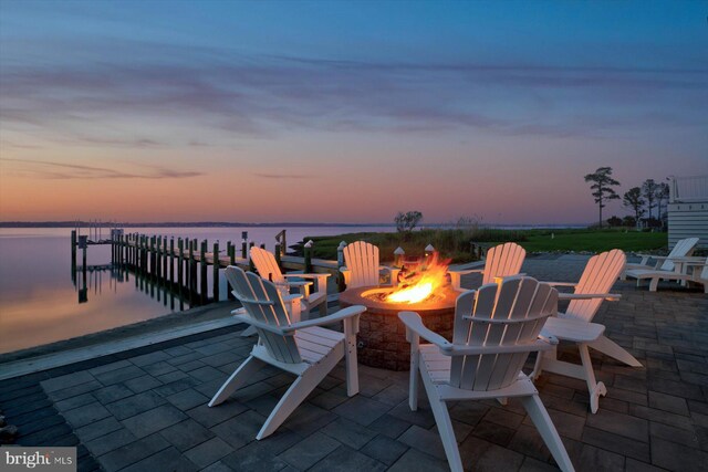 29710 Seagrass Ct, Dagsboro, DE 19939 - patio terrace at dusk with an outdoor fire pit, a water view, and a boat dock