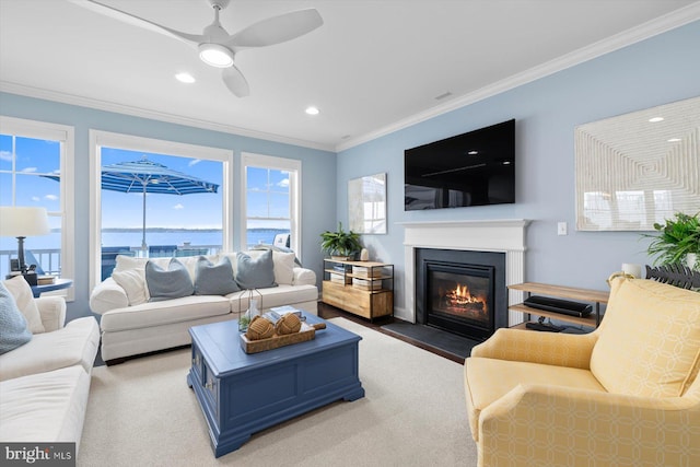 29710 Seagrass Ct, Dagsboro, DE 19939 - living room with ceiling fan, ornamental molding, a wealth of natural light, and a fireplace with flush hearth