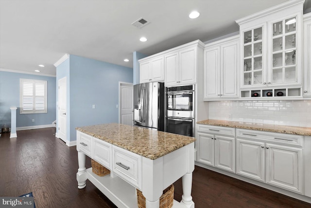 29710 Seagrass Ct, Dagsboro, DE 19939 - kitchen featuring white cabinetry, tasteful backsplash, visible vents, and appliances with stainless steel finishes
