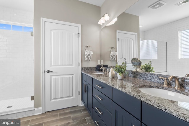 29710 Seagrass Ct, Dagsboro, DE 19939 - full bathroom featuring a stall shower, visible vents, a sink, and double vanity