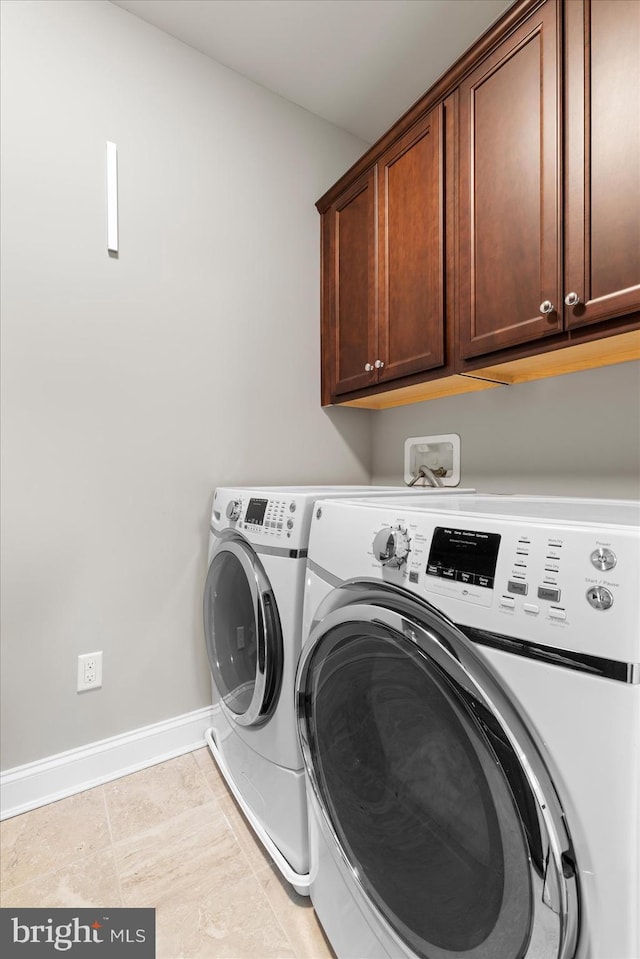 29710 Seagrass Ct, Dagsboro, DE 19939 - clothes washing area featuring cabinet space, baseboards, and washer and dryer