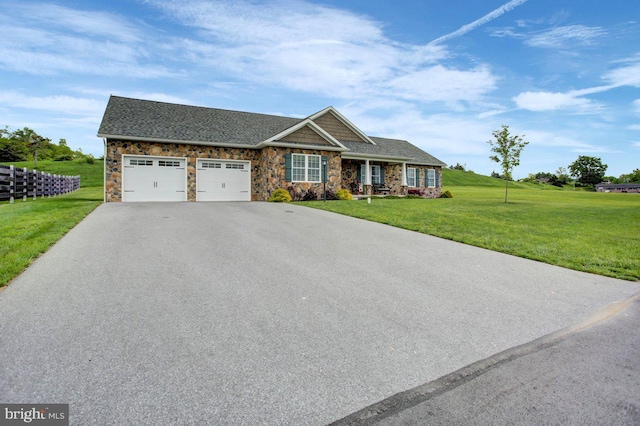 230 Meadowcreek Dr N, Chambersburg, PA 17202 - view of front facade featuring an attached garage, a shingled roof, stone siding, aphalt driveway, and a front lawn