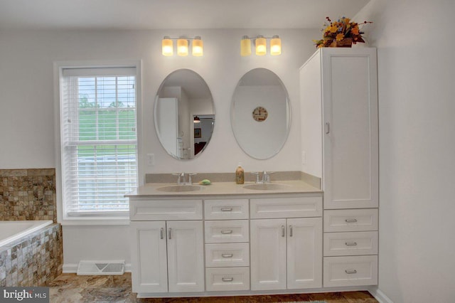 230 Meadowcreek Dr N, Chambersburg, PA 17202 - full bath featuring a sink, double vanity, baseboards, and visible vents