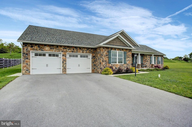 230 Meadowcreek Dr N, Chambersburg, PA 17202 - craftsman-style home with a front yard, an attached garage, stone siding, and driveway