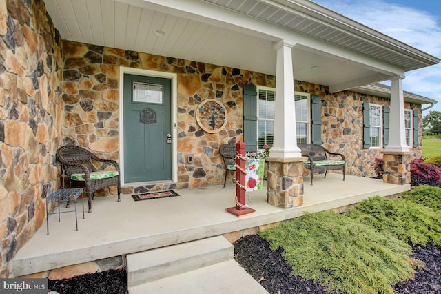 230 Meadowcreek Dr N, Chambersburg, PA 17202 - doorway to property featuring stone siding and a porch