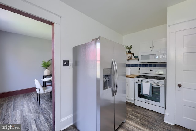 kitchen featuring dark wood-style flooring, open shelves, white appliances, white cabinetry, and backsplash