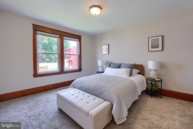 bedroom featuring carpet floors and baseboards