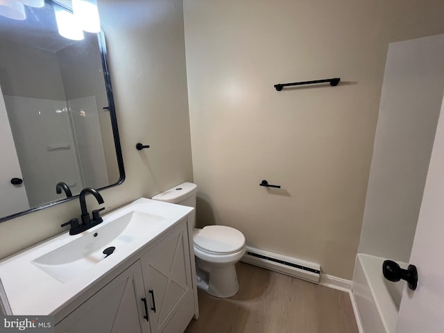 28 Wenner Dr, Brunswick, MD 21716 - full bathroom featuring vanity, toilet, baseboards, wood finished floors, and a baseboard heating unit
