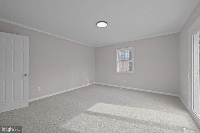 unfurnished bedroom with baseboards, ornamental molding, and carpet