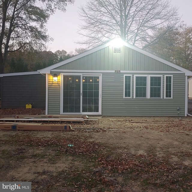 back of property with board and batten siding