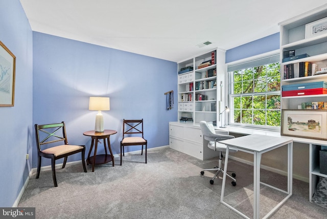 office space with baseboards, carpet flooring, and visible vents
