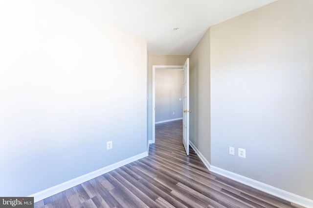 645 Constellation Sq SE Unit L, Leesburg, VA 20175 - unfurnished room with baseboards and dark wood-style floors