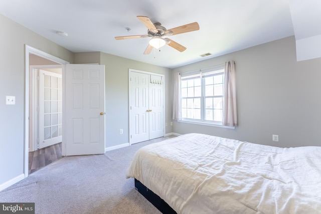 645 Constellation Sq SE Unit L, Leesburg, VA 20175 - carpeted bedroom with baseboards, ceiling fan, a closet, and visible vents