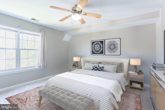 645 Constellation Sq SE Unit L, Leesburg, VA 20175 - bedroom featuring light colored carpet, baseboards, visible vents, and a ceiling fan
