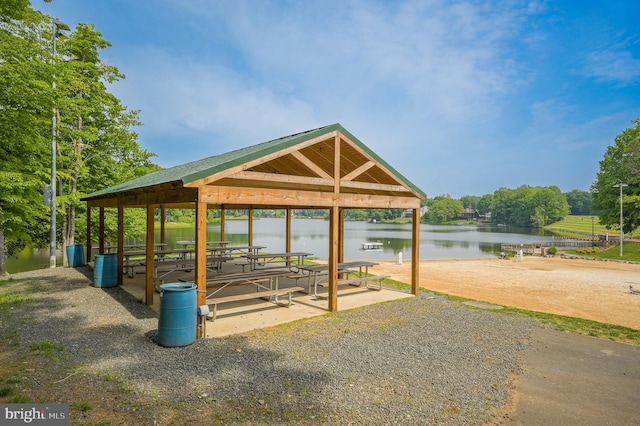 view of property's community with a gazebo and a water view