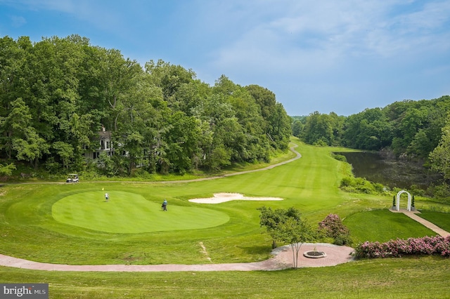 view of home's community featuring a water view and golf course view