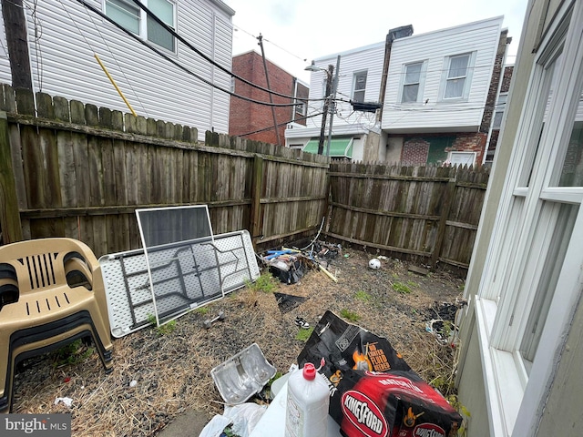 view of yard with a fenced backyard