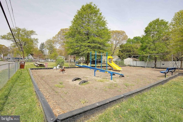 community jungle gym with fence