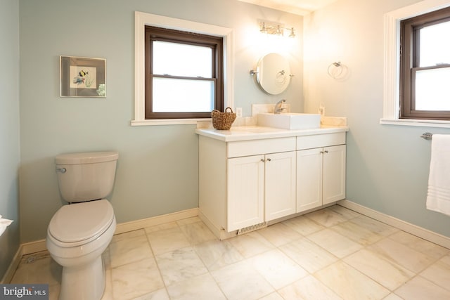 3734 1st Ave, Edgewater, MD 21037 - bathroom featuring toilet, marble finish floor, vanity, and baseboards