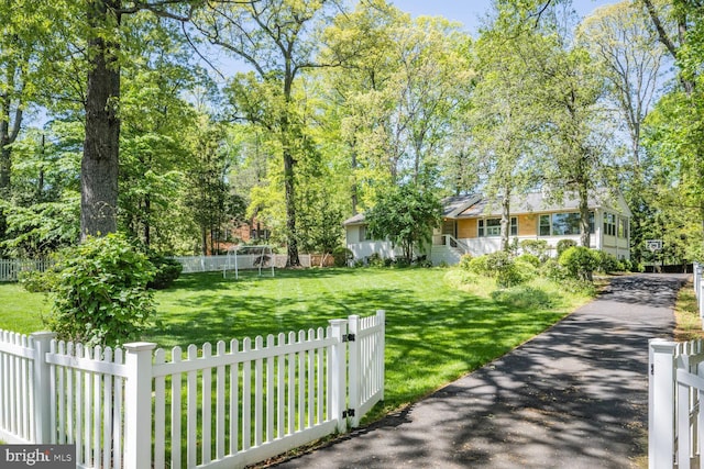 exterior space with a fenced backyard and a yard