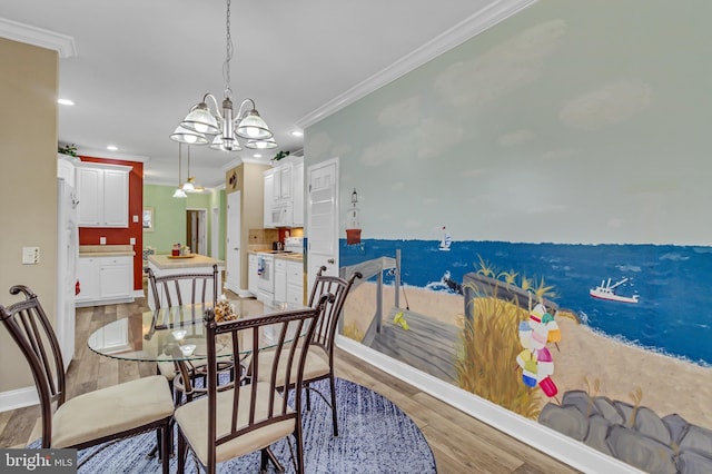 33 Douglas St, Reedville, VA 22539 - dining area with recessed lighting, a chandelier, crown molding, light wood-style flooring, and baseboards