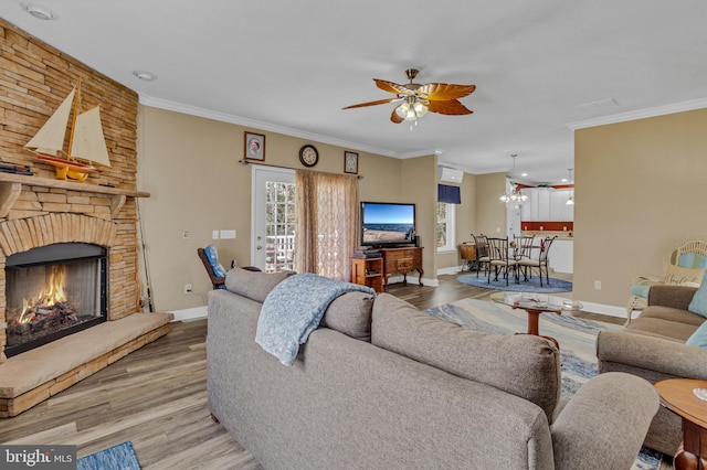 33 Douglas St, Reedville, VA 22539 - living room with wood finished floors, a healthy amount of sunlight, ornamental molding, and ceiling fan with notable chandelier