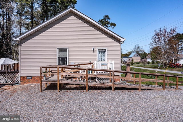 33 Douglas St, Reedville, VA 22539 - rear view of property with a wooden deck and crawl space