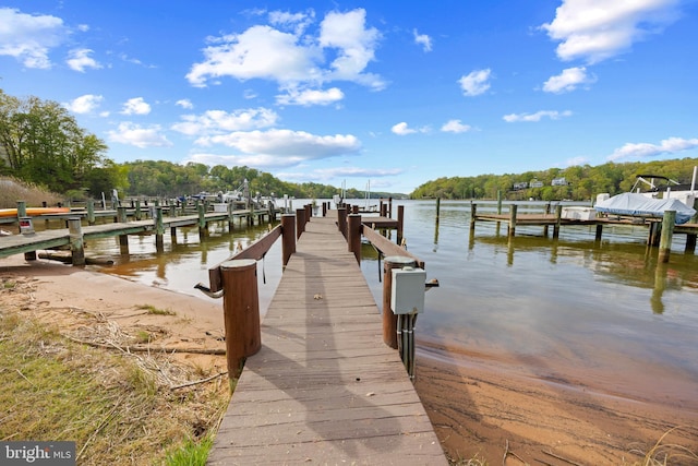 view of dock featuring a water view and boat lift
