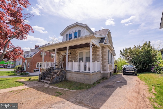 4513 Kenwood Ave, Baltimore, MD 21206 - bungalow with driveway, covered porch, and roof with shingles