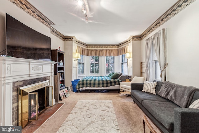 2217 Locust St, Philadelphia, PA 19103 - carpeted bedroom with a fireplace with flush hearth, crown molding, and track lighting
