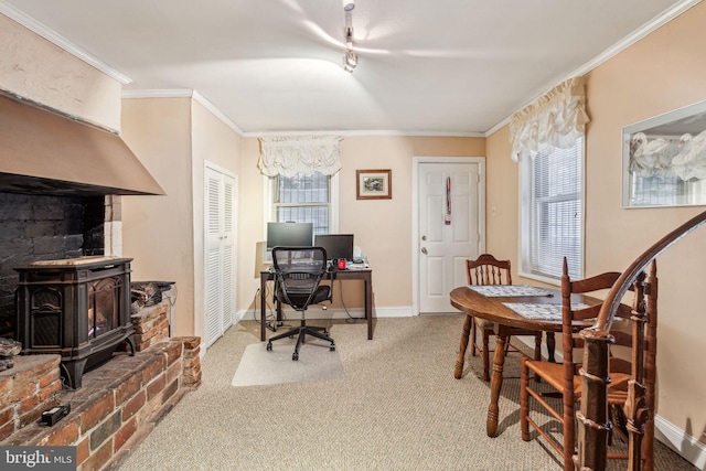 2217 Locust St, Philadelphia, PA 19103 - carpeted home office featuring crown molding, a notable chandelier, a wood stove, and baseboards