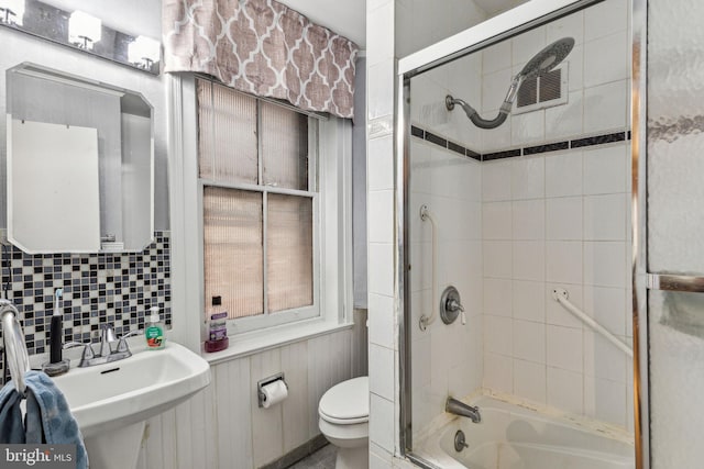 2217 Locust St, Philadelphia, PA 19103 - full bathroom with decorative backsplash, enclosed tub / shower combo, toilet, a sink, and visible vents