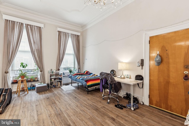 2217 Locust St, Philadelphia, PA 19103 - interior space featuring crown molding, an inviting chandelier, a wealth of natural light, and wood finished floors