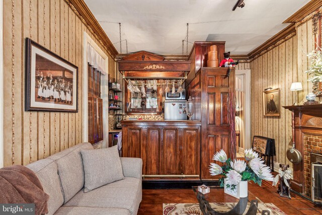 2217 Locust St, Philadelphia, PA 19103 - living room featuring dark wood-style flooring, bar, and wallpapered walls