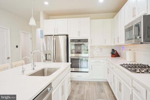 43 Pratt, Lawrence Township, NJ 08648 - kitchen featuring a sink, white cabinets, and appliances with stainless steel finishes